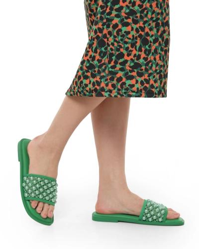 Textile mules adorned with large green beads