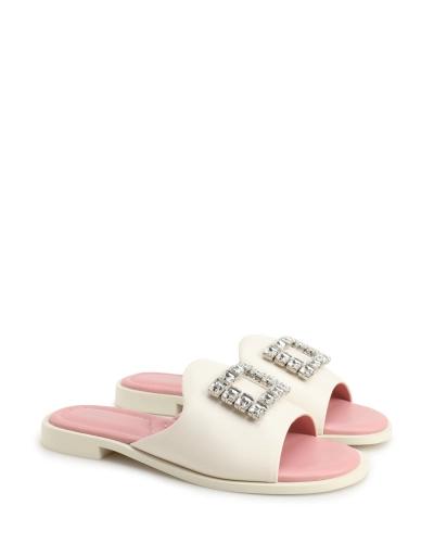 Mules with a rhinestone-embellished buckle