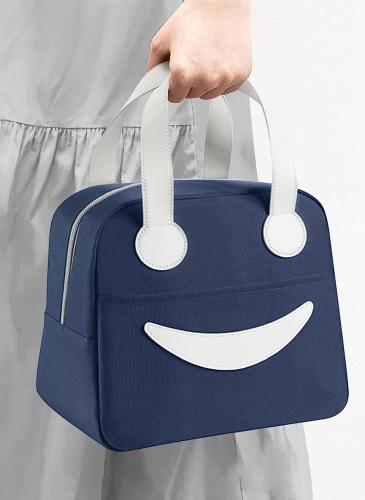 Navy blue insulated lunch bag with white handles