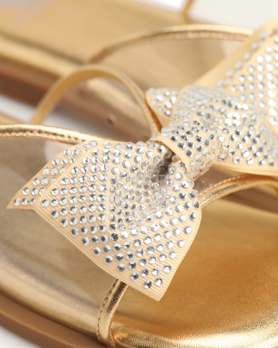 Mules with a rhinestone-embellished bow