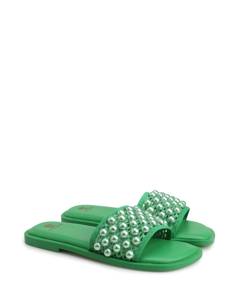 Textile mules adorned with large green beads