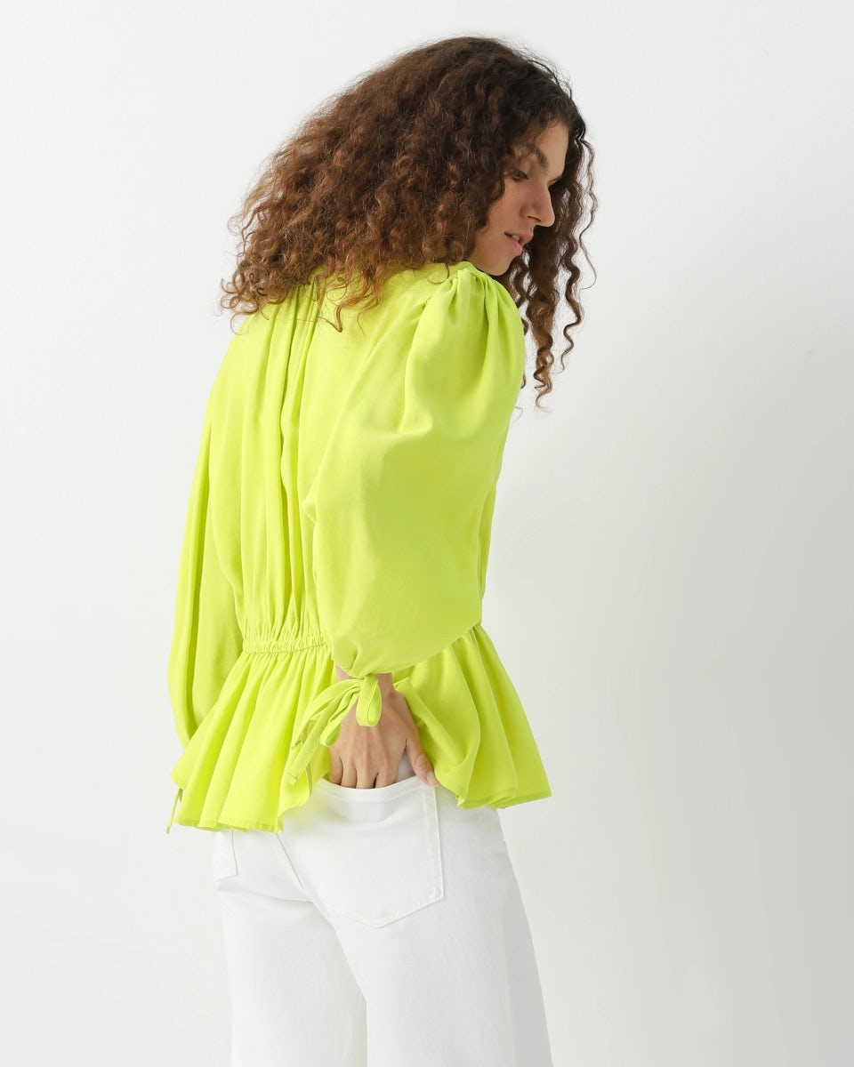 Loose blouse with elastic bands and tie-ups at the neckline