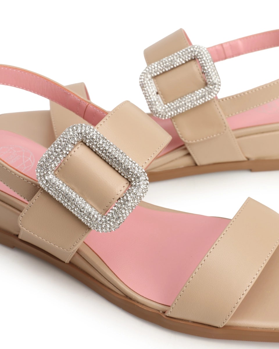 Wedge sandals with a rhinestone-embellished clasp