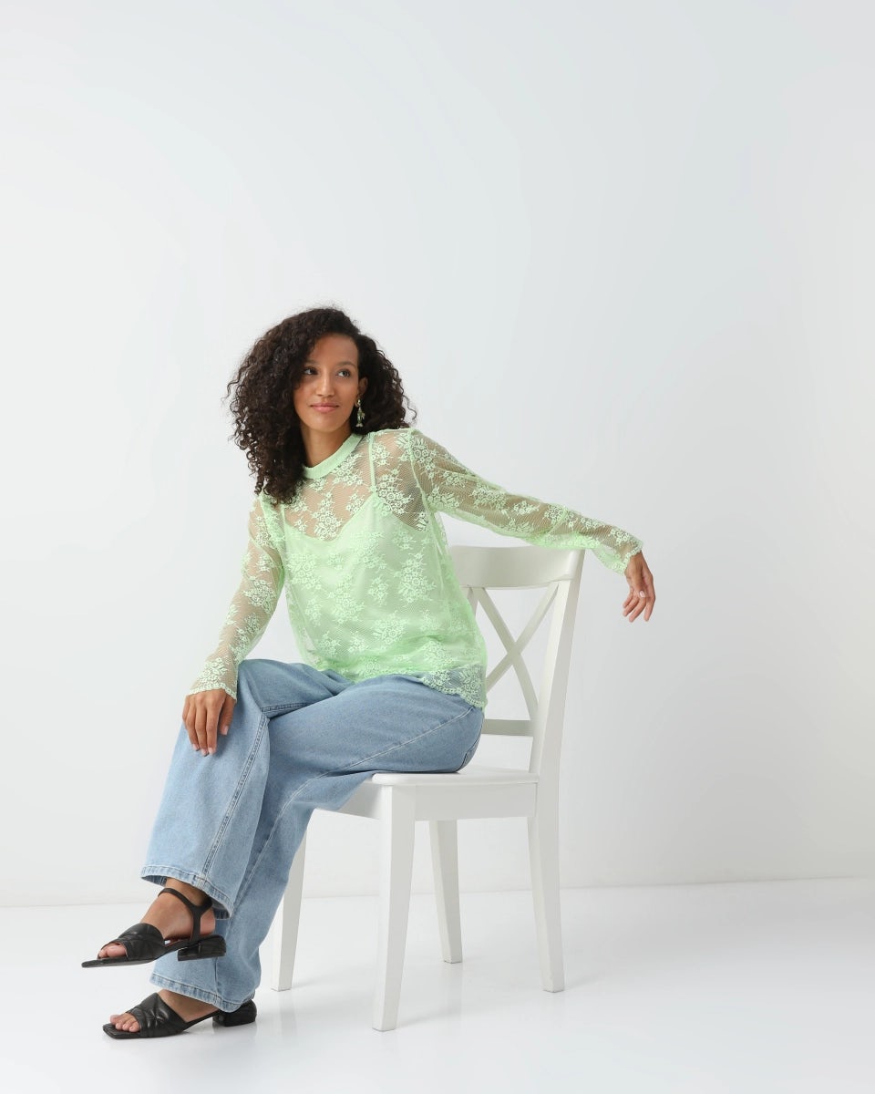 Lace blouse with an inner camisole