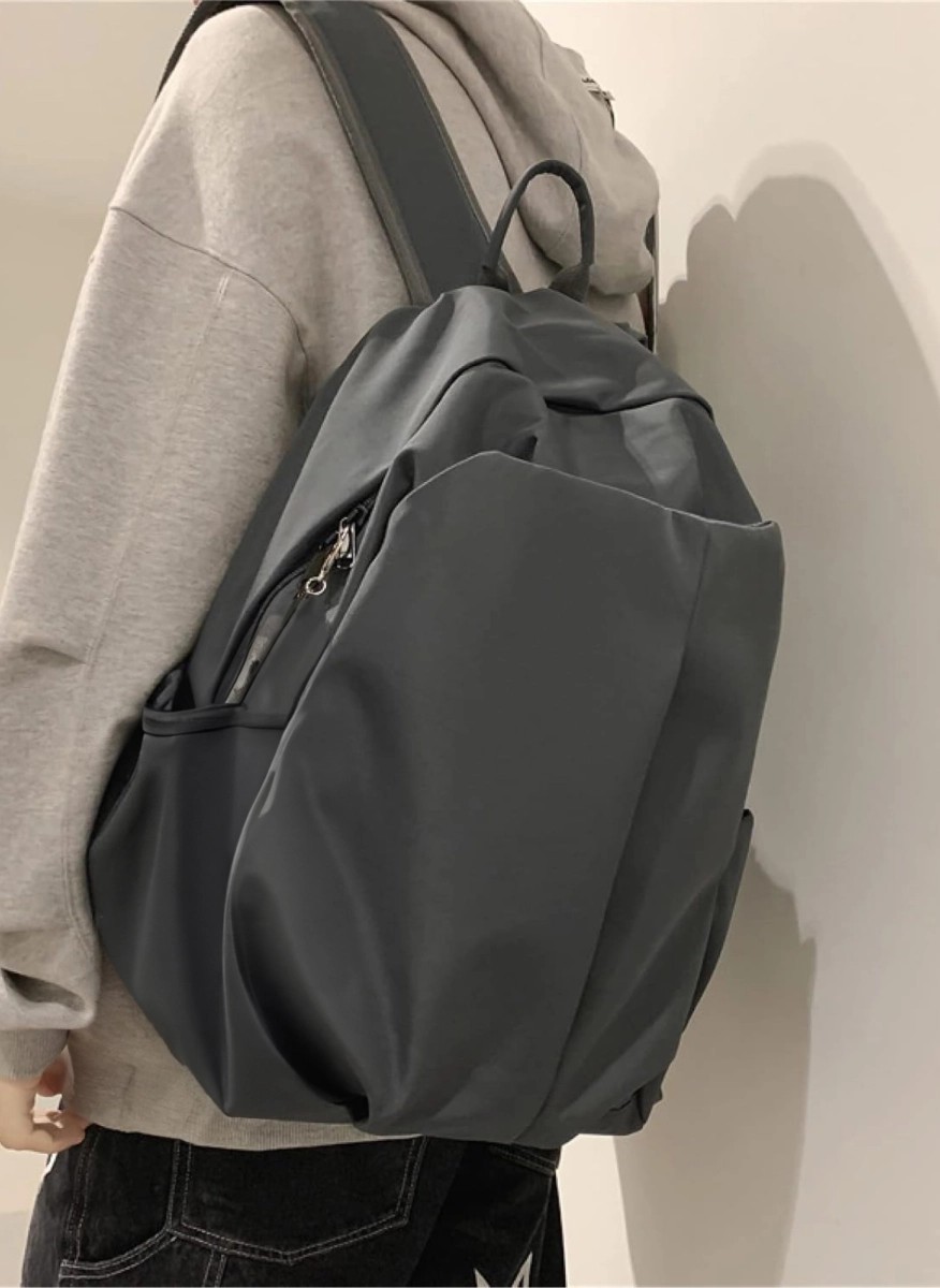 Sleek modern gray backpack with multiple pockets