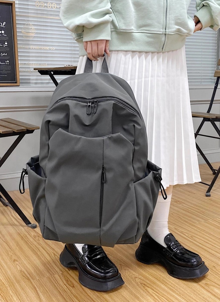 Sleek modern gray backpack with multiple pockets