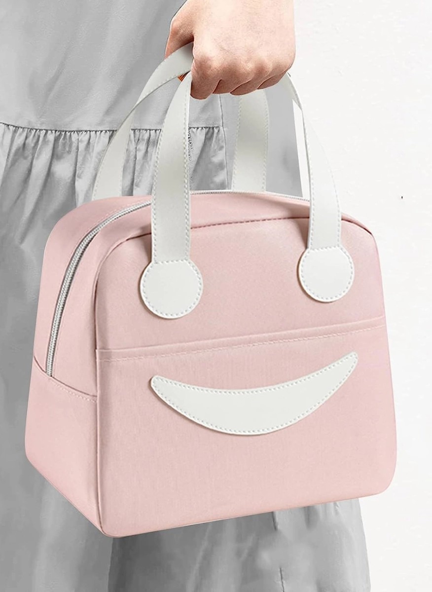 Pink insulated lunch bag with white handles